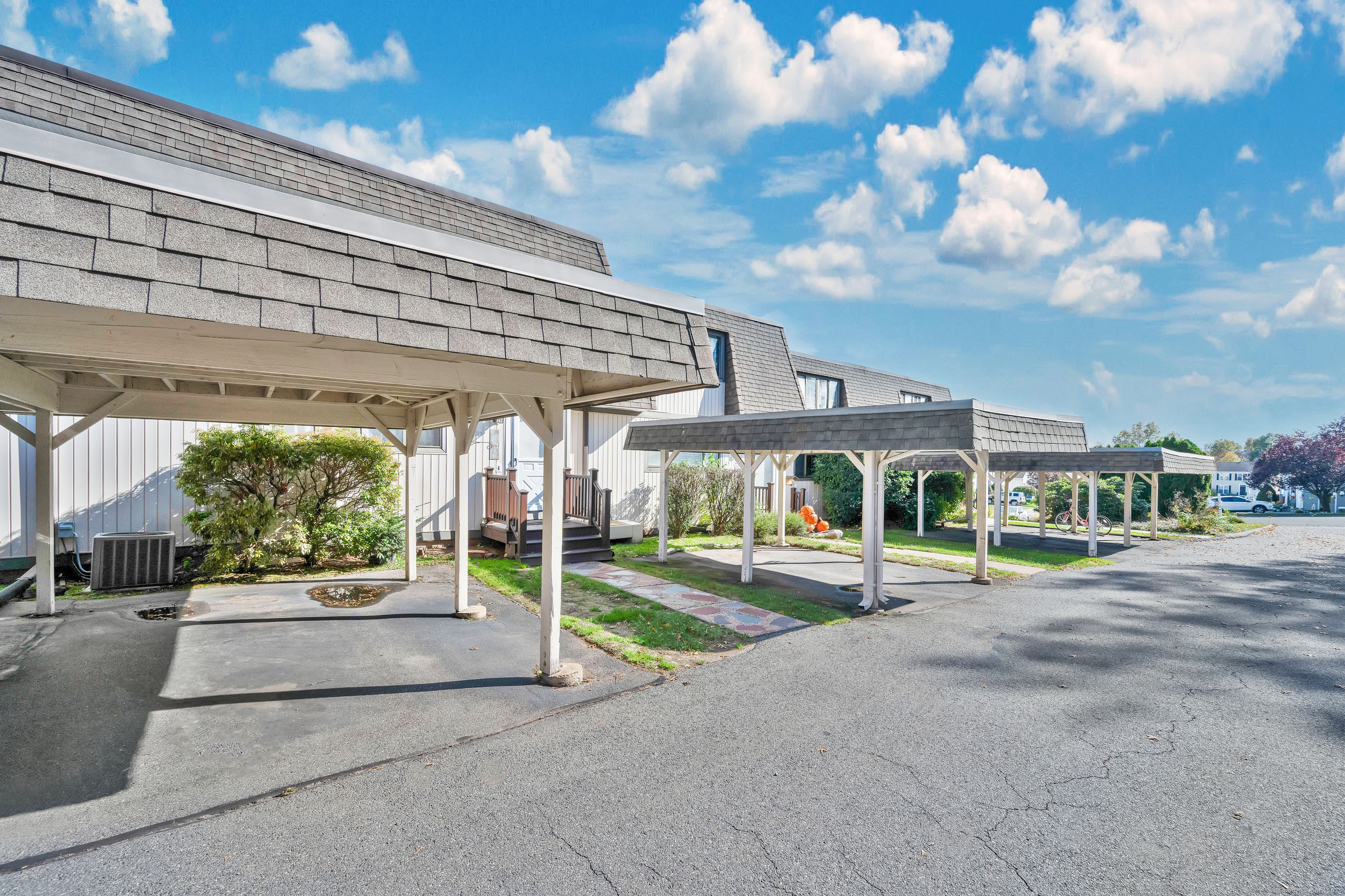 21 Pebblestone Circle, Unit 21 Suffield, CT 06078 - Photo 3 of 38 a view of a patio with table and chairs under an umbrella