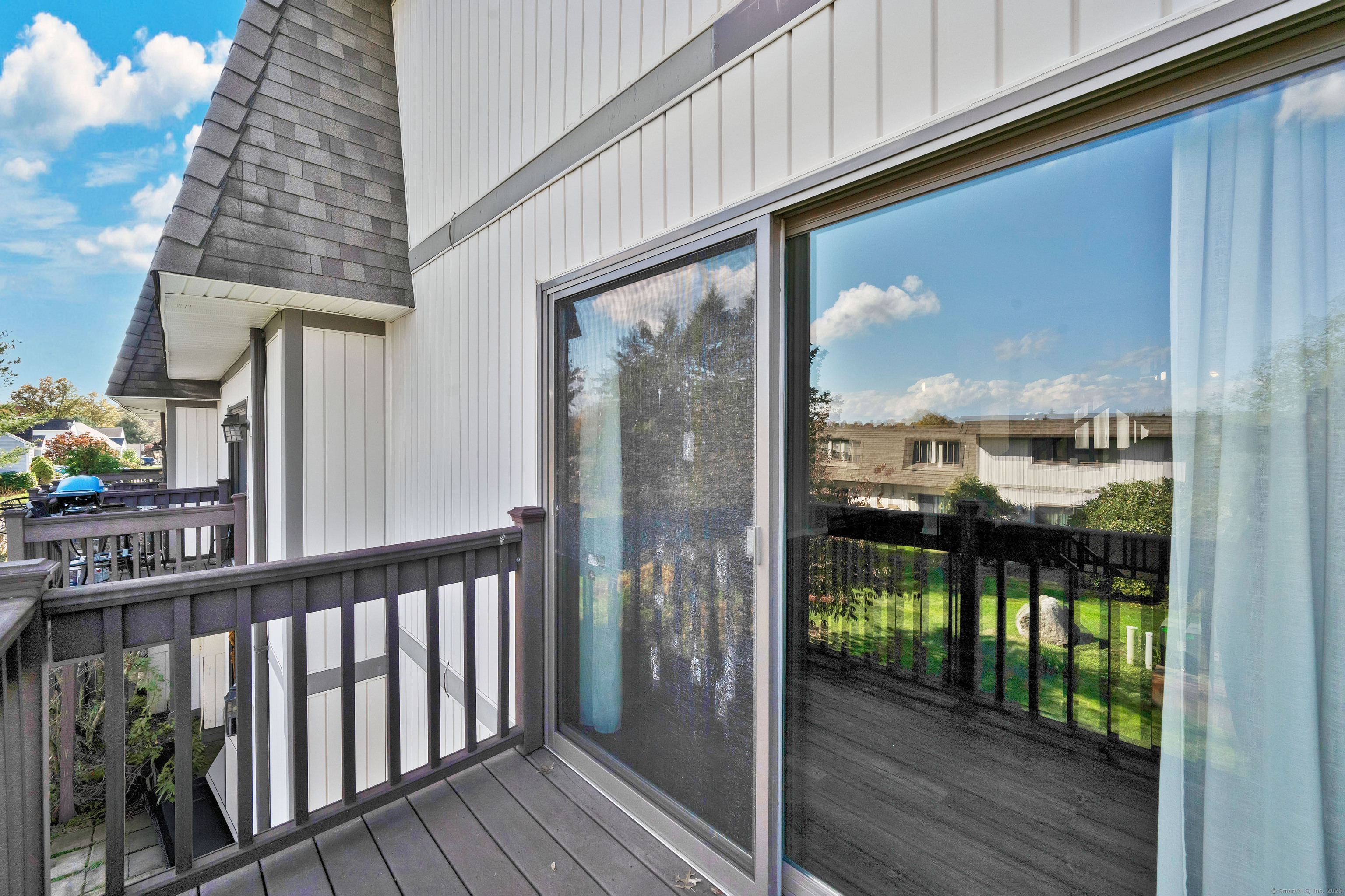 21 Pebblestone Circle, Unit 21 Suffield, CT 06078 - Photo 32 of 38 a view of a balcony with wooden floor