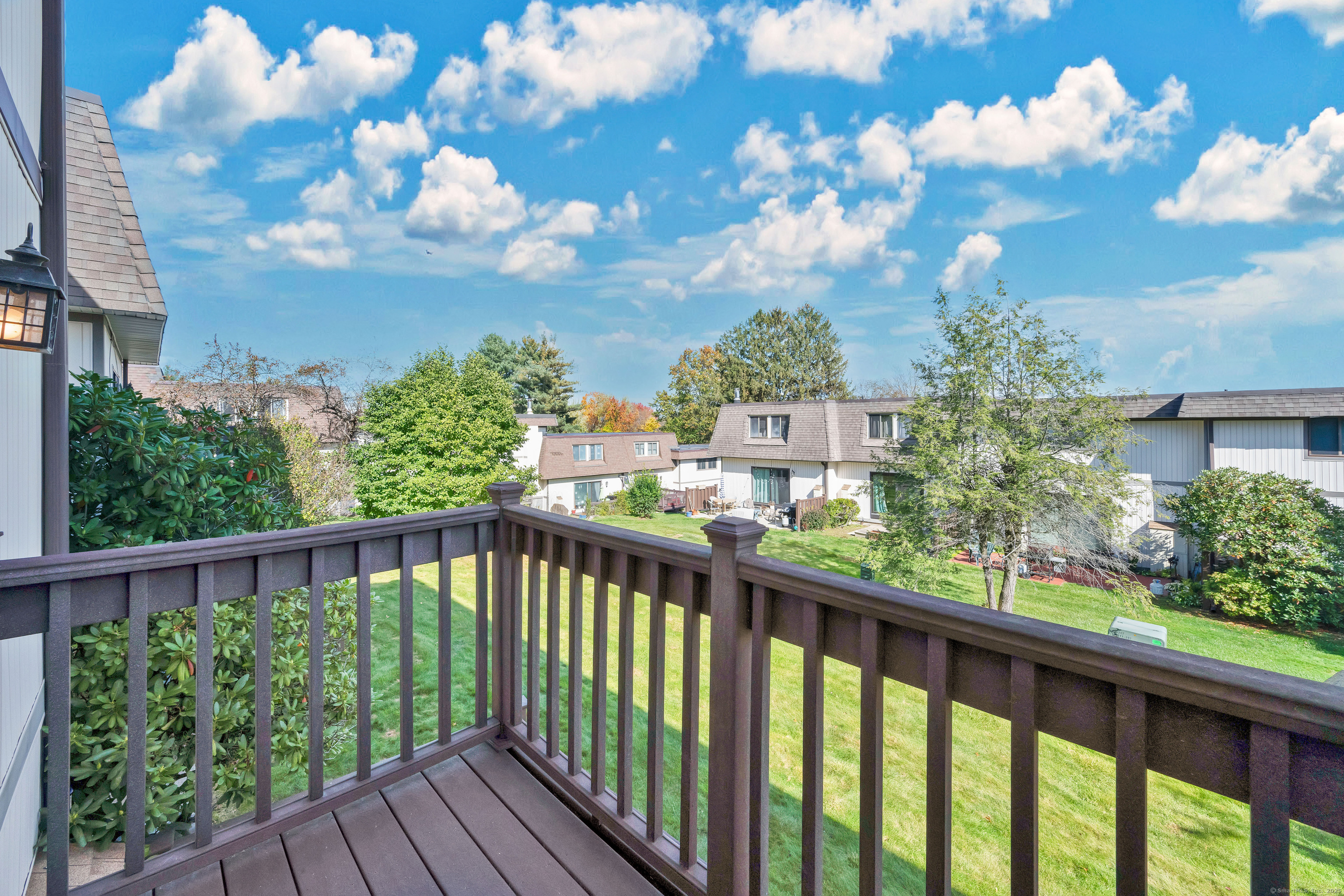 21 Pebblestone Circle, Unit 21 Suffield, CT 06078 - Photo 33 of 38 a view of a balcony with flower plants