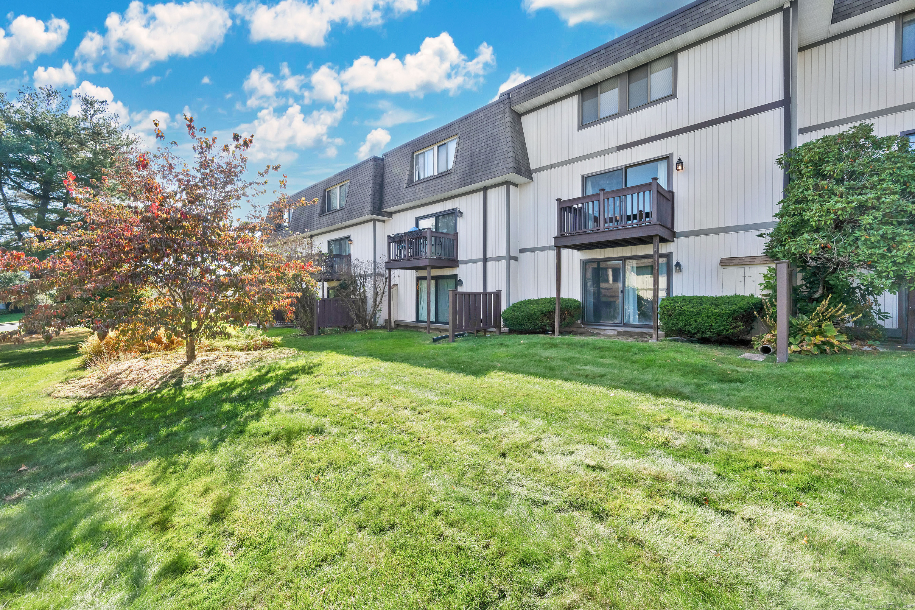 21 Pebblestone Circle, Unit 21 Suffield, CT 06078 - Photo 38 of 38 a view of a building with a yard