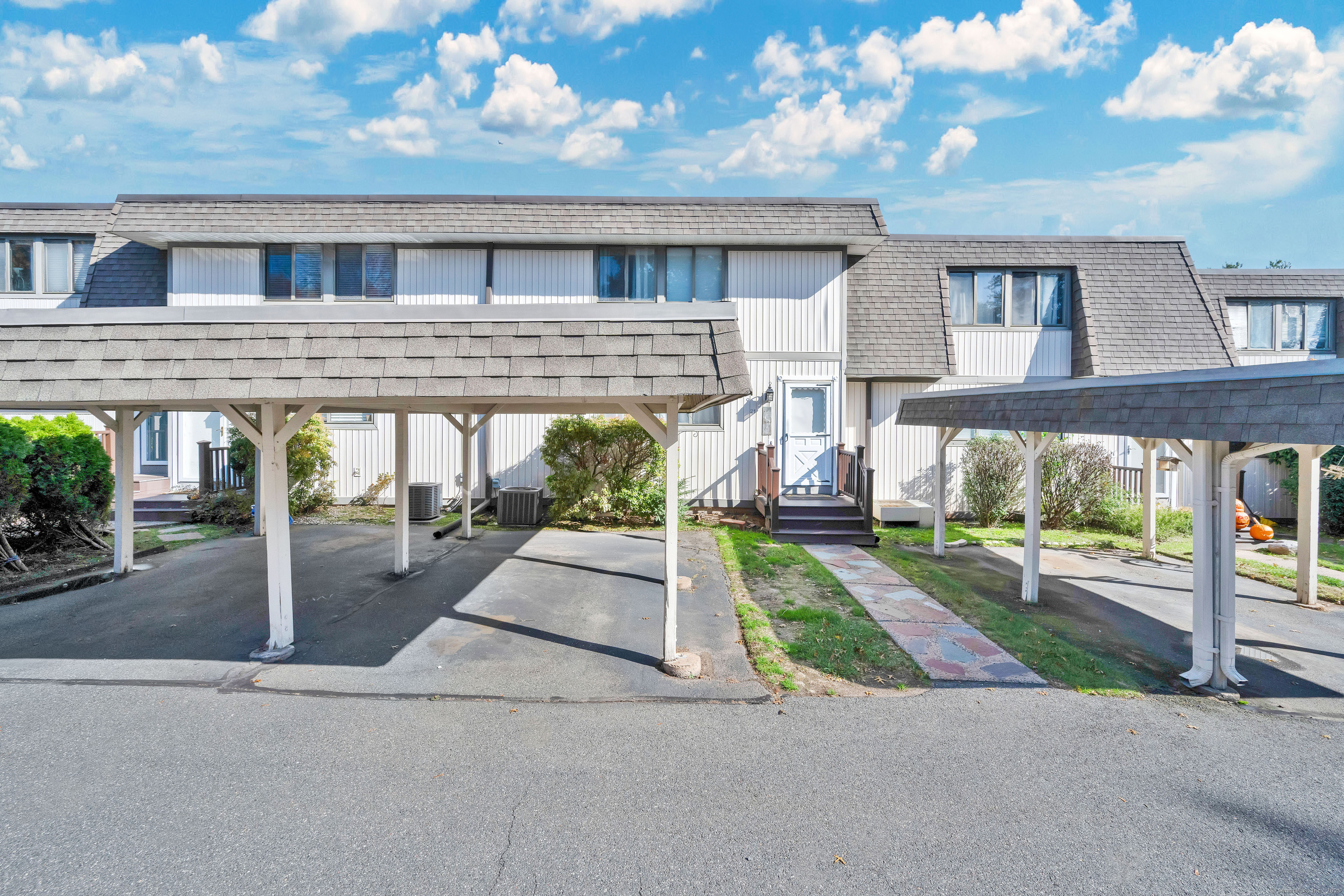 21 Pebblestone Circle, Unit 21 Suffield, CT 06078 - Photo 4 of 38 front view of house with a street