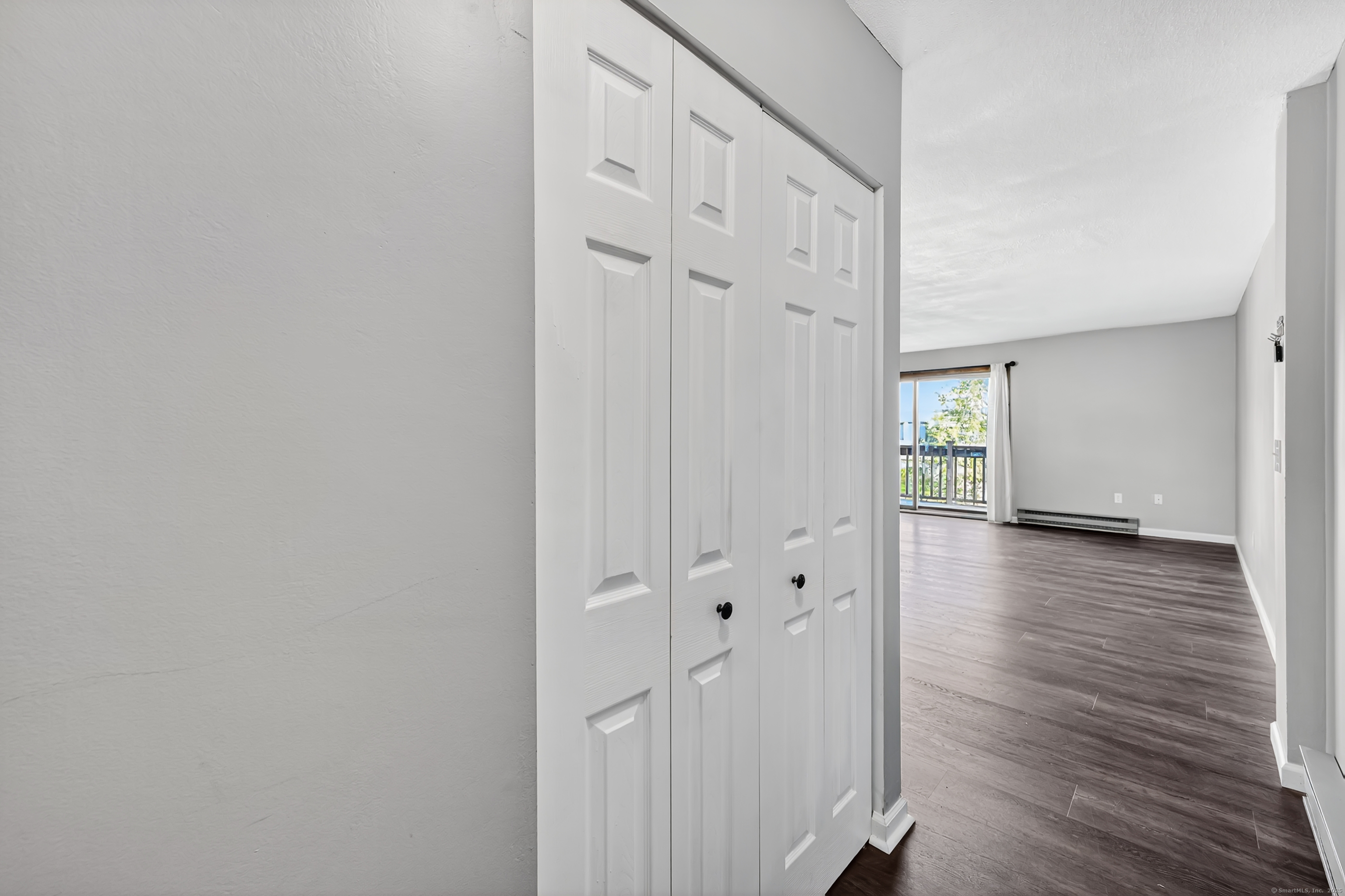 21 Pebblestone Circle, Unit 21 Suffield, CT 06078 - Photo 10 of 38 a view of a hallway with wooden floor