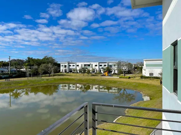 a view of a swimming pool with an ocean view