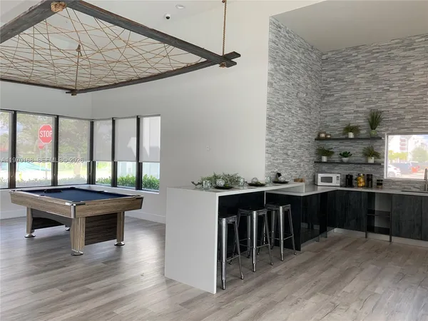 a kitchen with a table and chairs in it