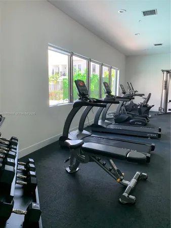 a bed room with a bed and a chandelier