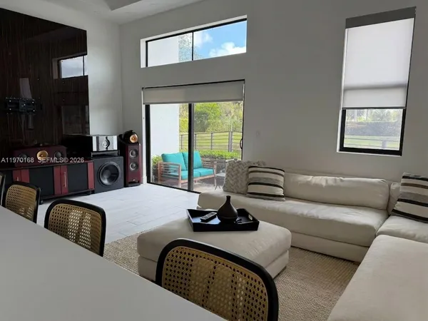 a bedroom with furniture and a window