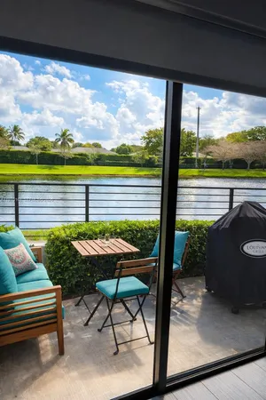 a view of a two chairs in the patio