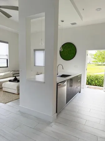 a view of a kitchen with a sink and a stove