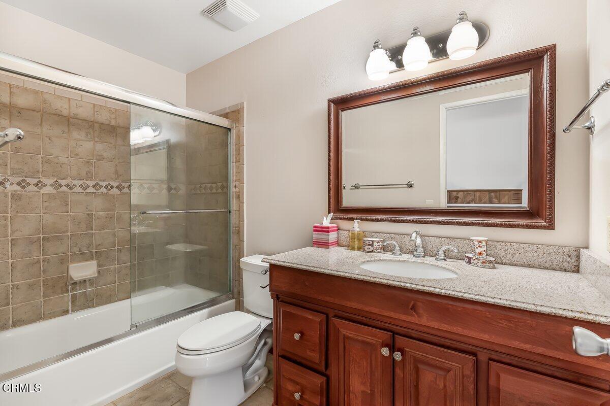 4800 Halsey Way Oxnard, CA 93033 - Photo 16 of 18 a bathroom with a sink vanity mirror and toilet
