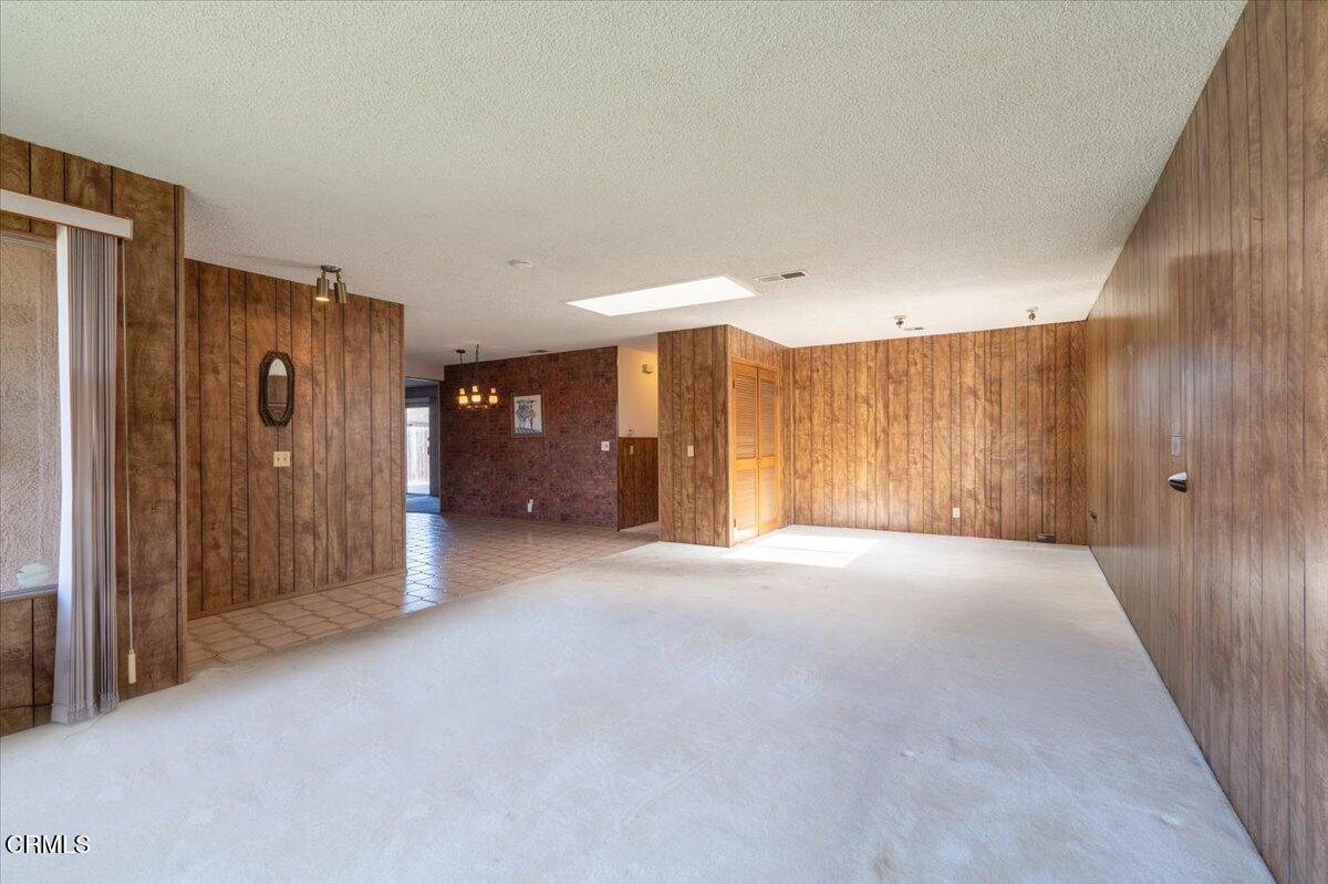 4800 Halsey Way Oxnard, CA 93033 - Photo 4 of 18 a view of a hallway with wooden walls
