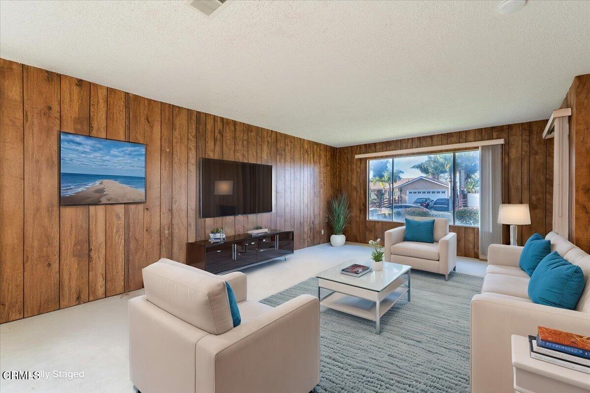4800 Halsey Way Oxnard, CA 93033 - Photo 5 of 18 a living room with furniture flat screen tv and a large window