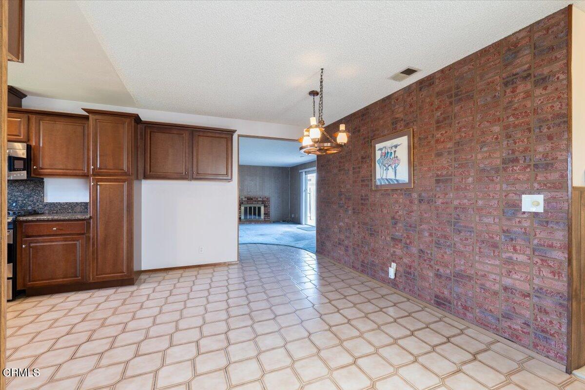 4800 Halsey Way Oxnard, CA 93033 - Photo 8 of 18 a view of a kitchen with a sink and a refrigerator