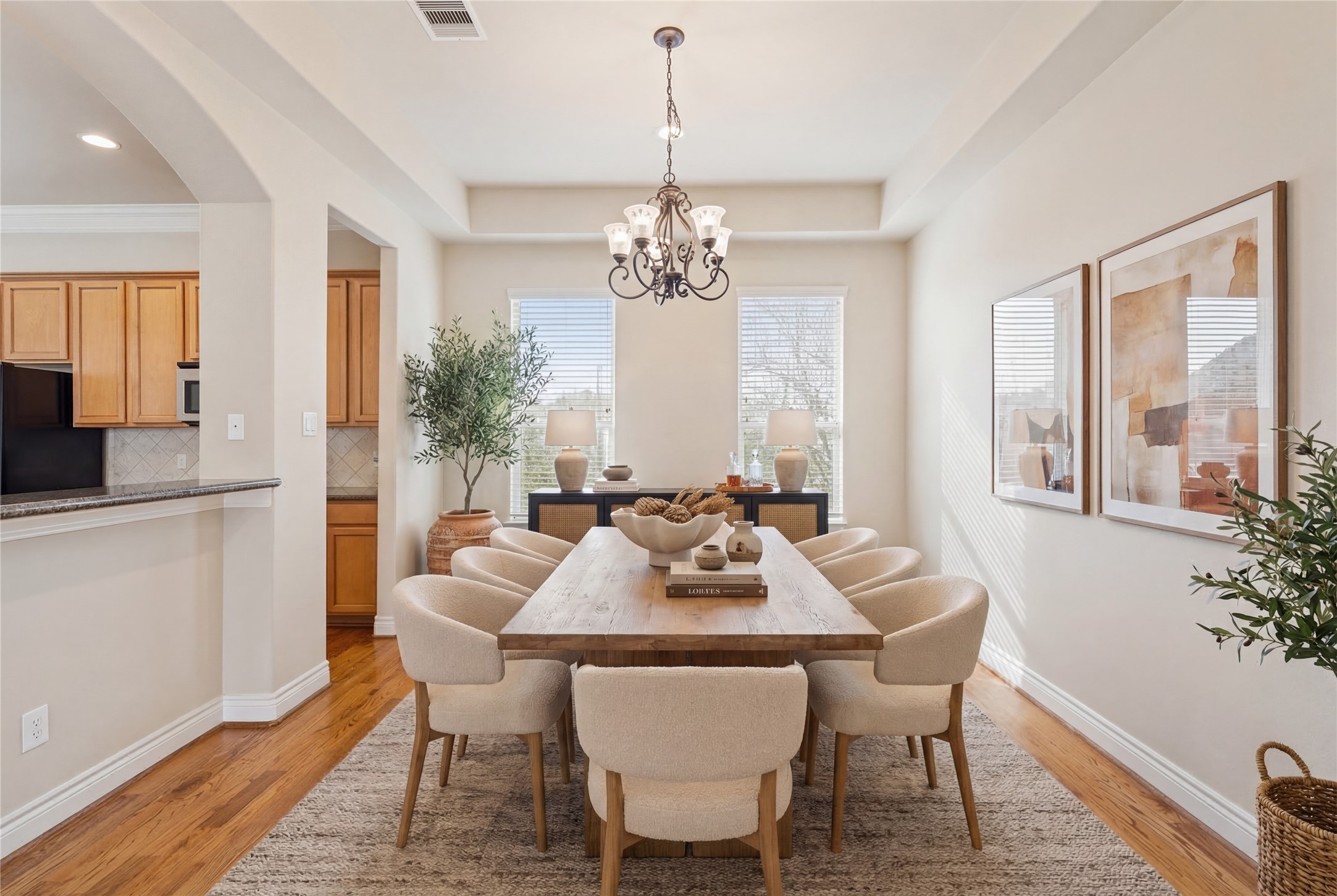 2830 Sherwin Street Houston, TX 77007 - Photo 9 of 26 Formal dining room with tray ceiling adjacent to the kitchen and living room. *This photo is virtually staged*