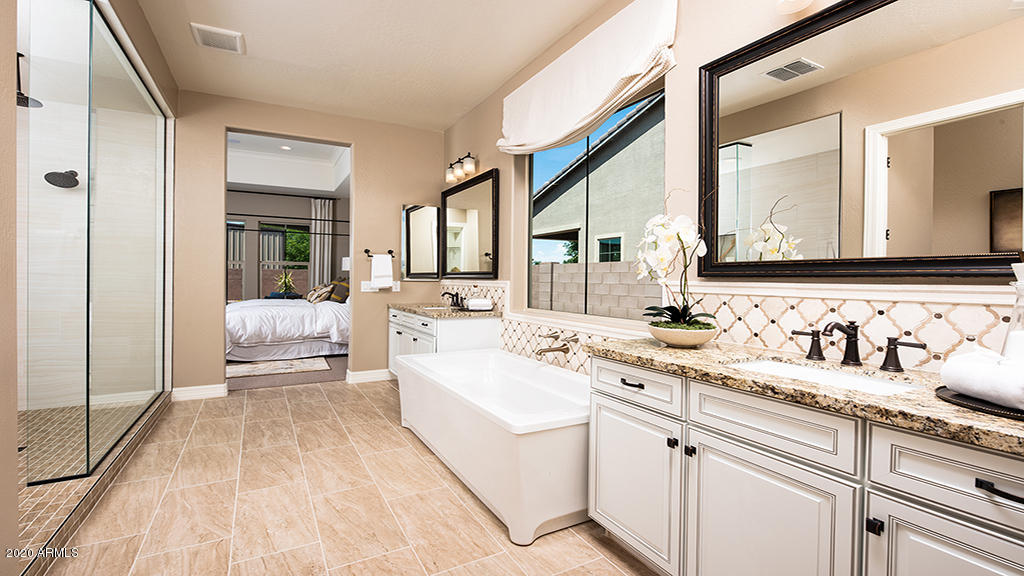 2046 East Trigger Way Gilbert, AZ 85297 - Photo 7 of 10 a en suite bathroom with a double vanity sink and mirror