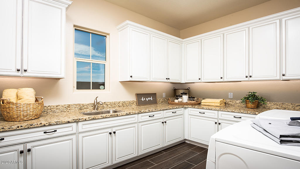 2046 East Trigger Way Gilbert, AZ 85297 - Photo 9 of 10 a kitchen with a sink and cabinets