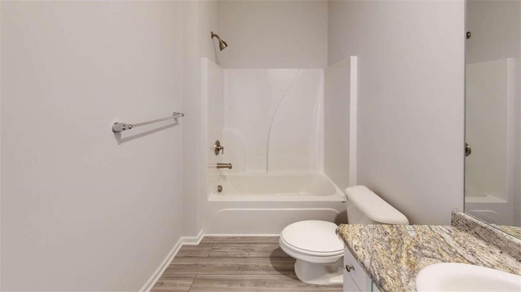 2026 Jessica Way Conyers, GA 30012 - Photo 10 of 10 a bathroom with a toilet and a shower