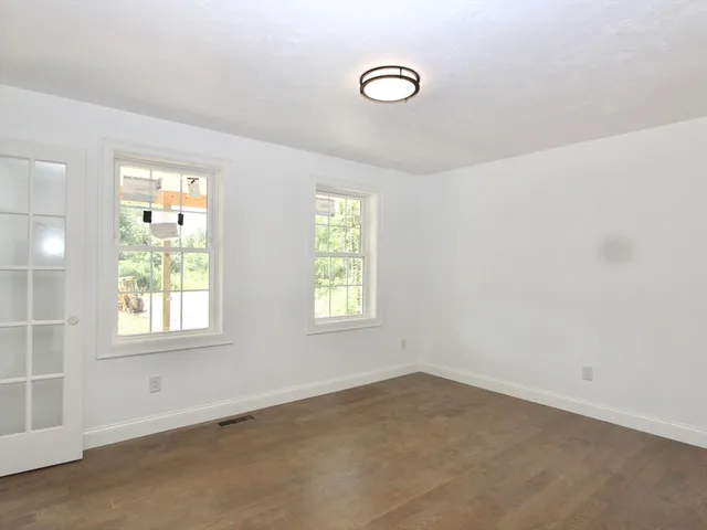 an empty room with windows