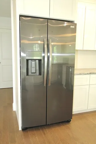 a bathroom with a glass shower door