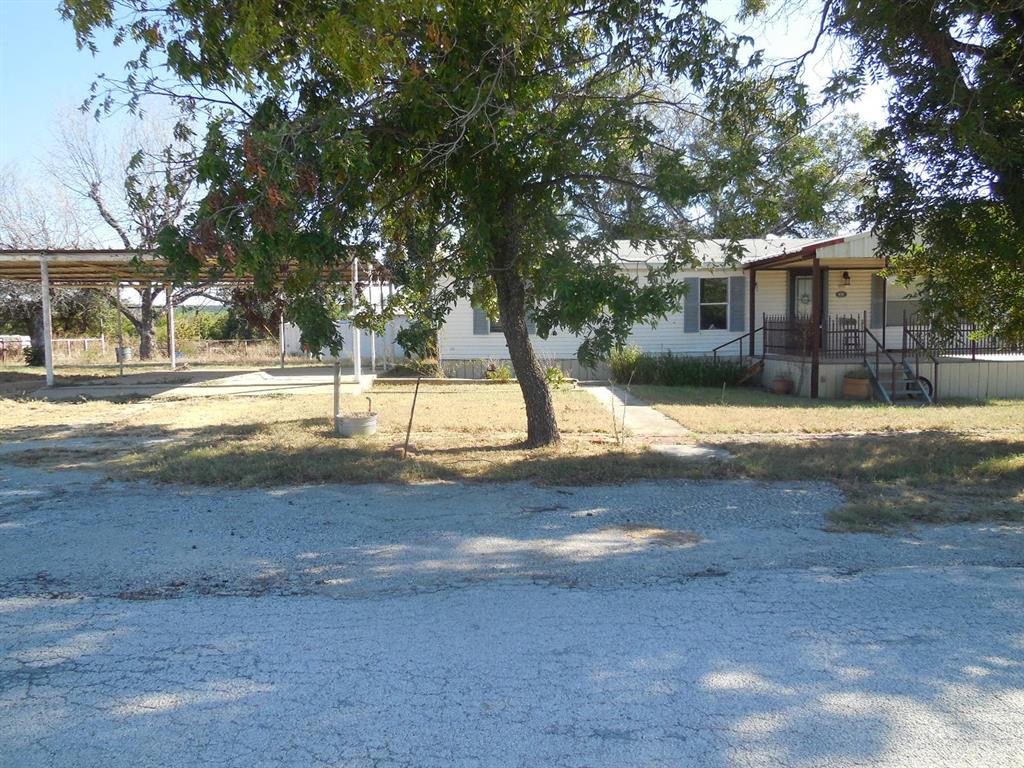 800 Melvin Street Ranger, TX 76470 - Photo 2 of 19 View of yard featuring a carport