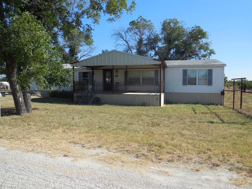 800 Melvin Street Ranger, TX 76470 - Photo 3 of 19 View of front of home with a front yard and a porch