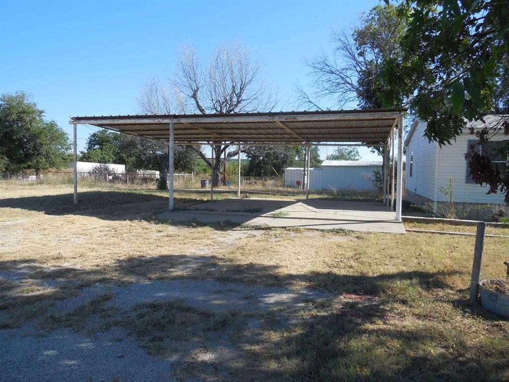 800 Melvin Street Ranger, TX 76470 - Photo 5 of 19 View of car parking featuring a yard and a carport