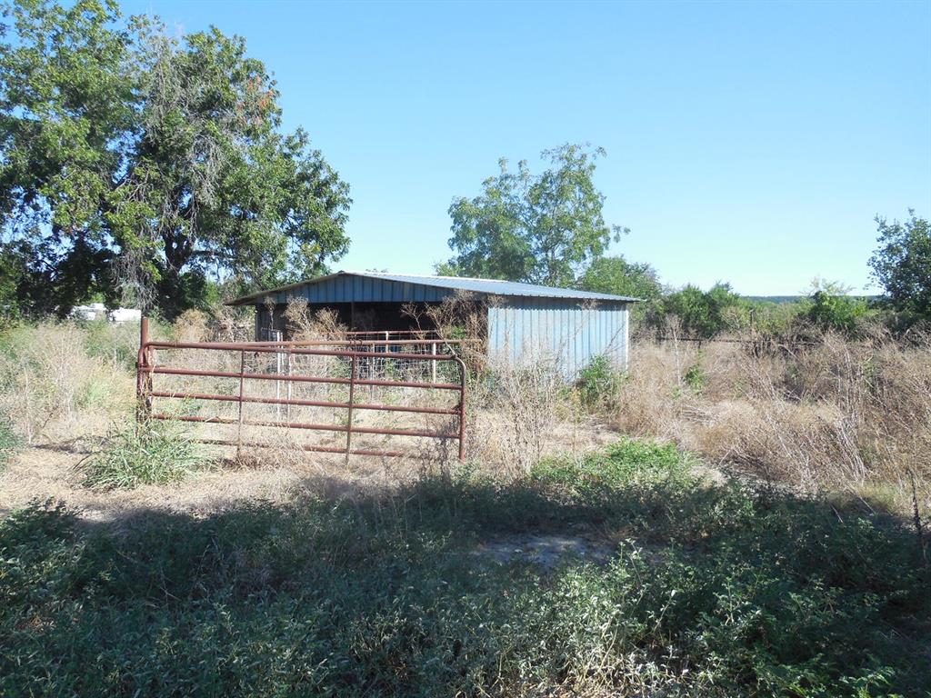 800 Melvin Street Ranger, TX 76470 - Photo 7 of 19 View of outbuilding with a rural view