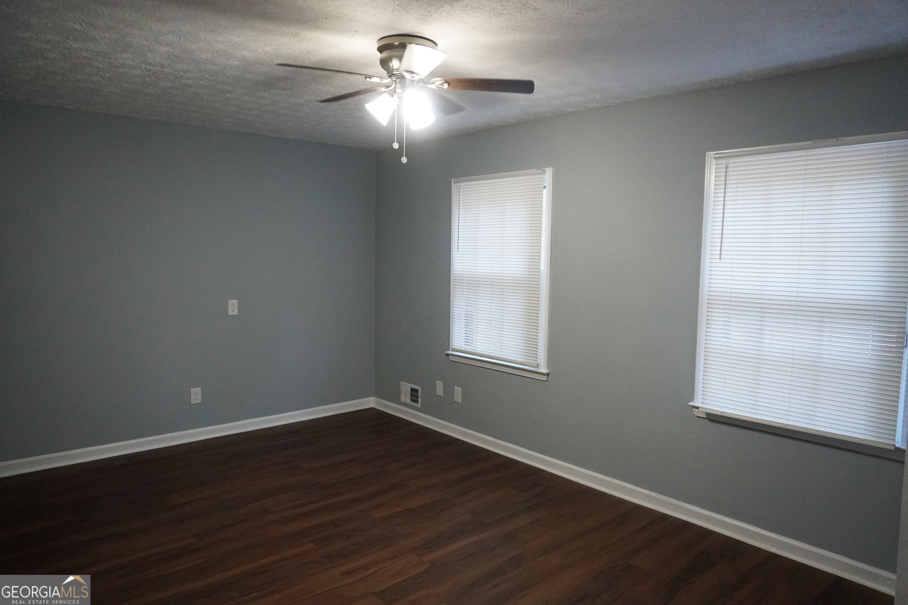 9243 Seminole Road Jonesboro, GA 30236 - Photo 19 of 40 a view of a room with wooden floor and windows