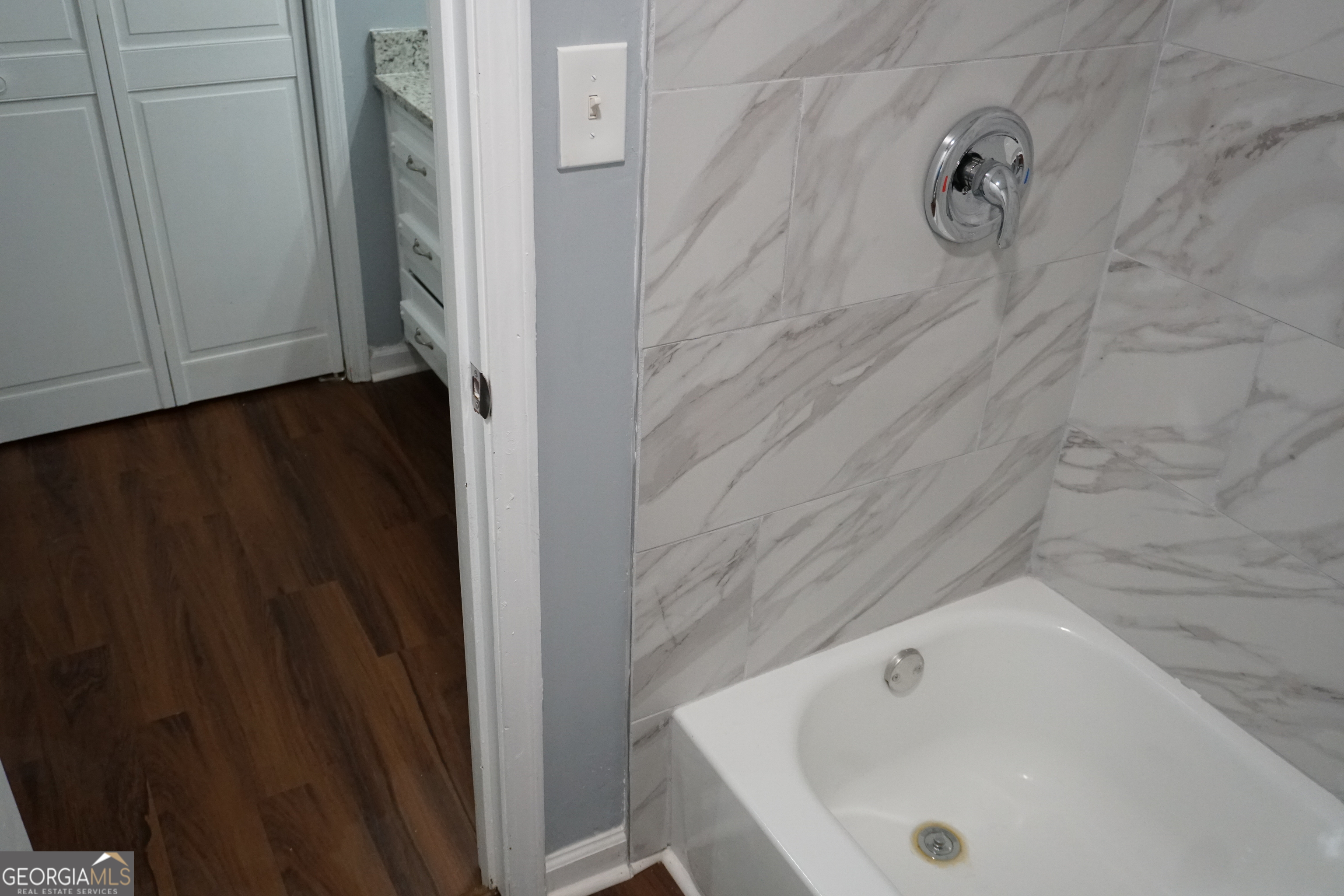9243 Seminole Road Jonesboro, GA 30236 - Photo 34 of 40 a bathroom with a white bath tub
