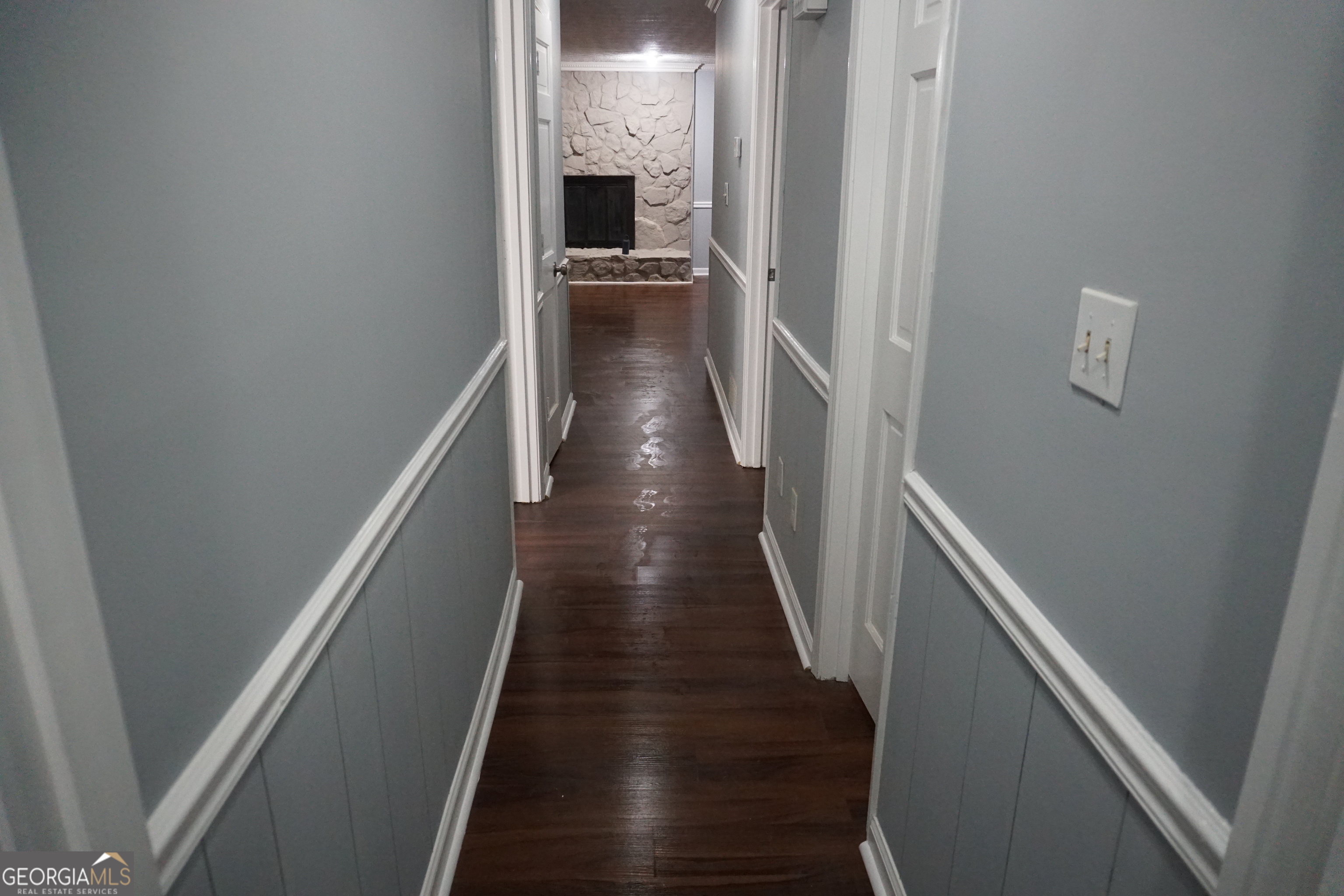 9243 Seminole Road Jonesboro, GA 30236 - Photo 35 of 40 a view of a hallway with wooden floor and staircase