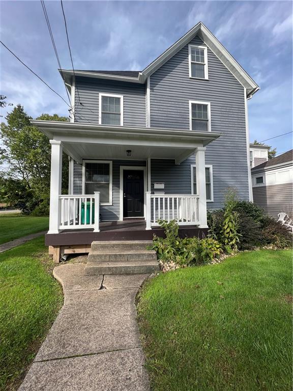 a view of a house with garden and plants