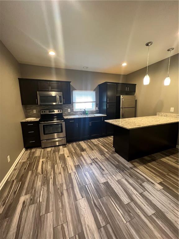 1105 Riverside Drive, Unit 2 Beaver, PA 15009 - Photo 5 of 21 a large kitchen with kitchen island a sink stainless steel appliances and cabinets