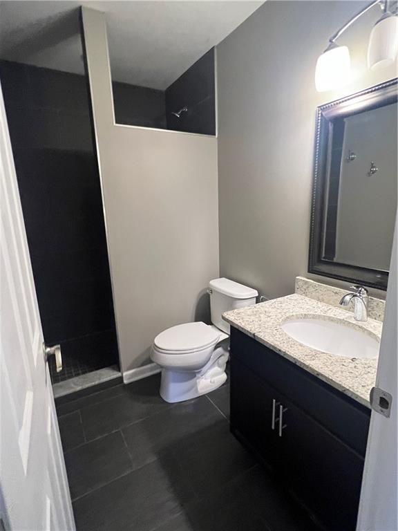 1105 Riverside Drive, Unit 2 Beaver, PA 15009 - Photo 10 of 21 a bathroom with a granite countertop sink toilet and mirror