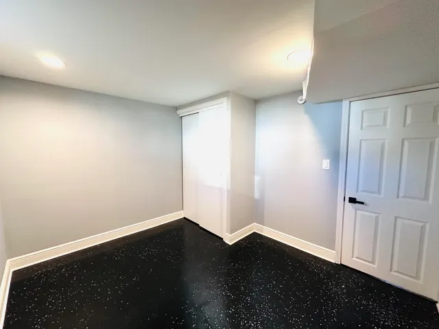 a bathroom with a shower sink and mirror