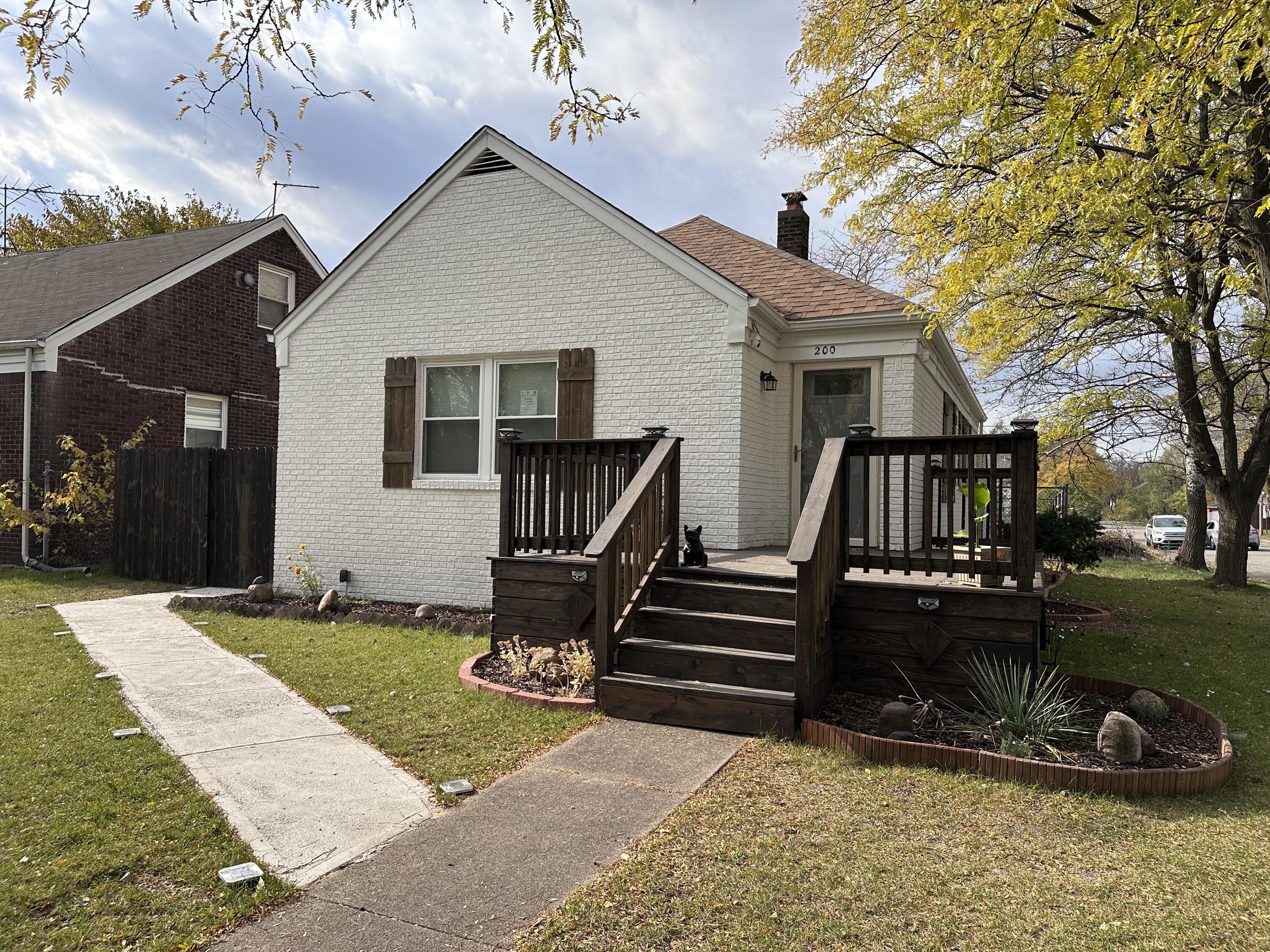 200 Taft Place Gary, IN 46404 - Photo 2 of 18 a front view of a house with a yard