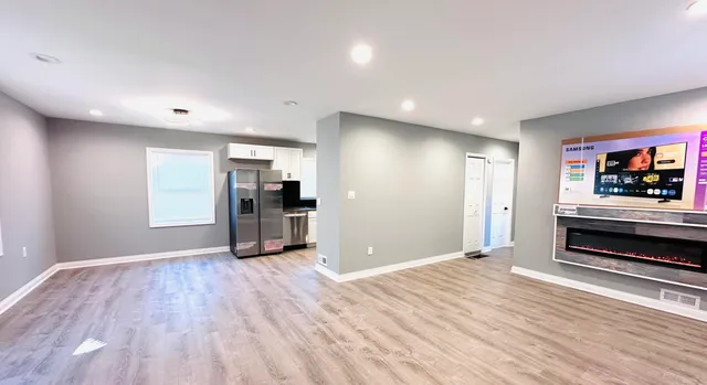 a view of a kitchen with a sink and a stove top oven