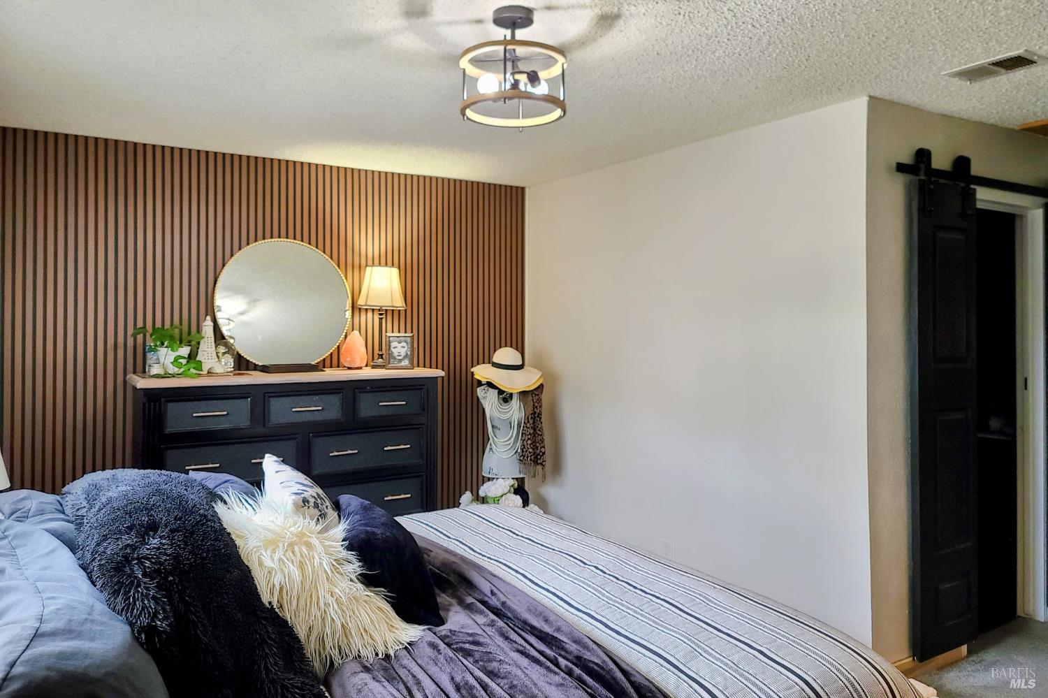 Undisclosed Address Rohnert Park, CA 94928 - Photo 25 of 38 a bed room with a bed and a mirror