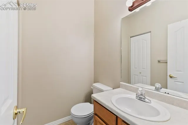 a bathroom with a sink toilet and vanity
