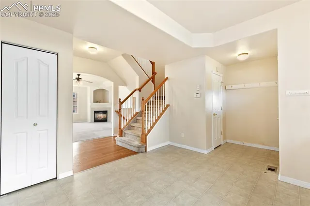 a view of an entryway with wooden floor