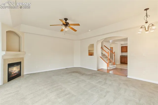 a view of empty room with a fireplace
