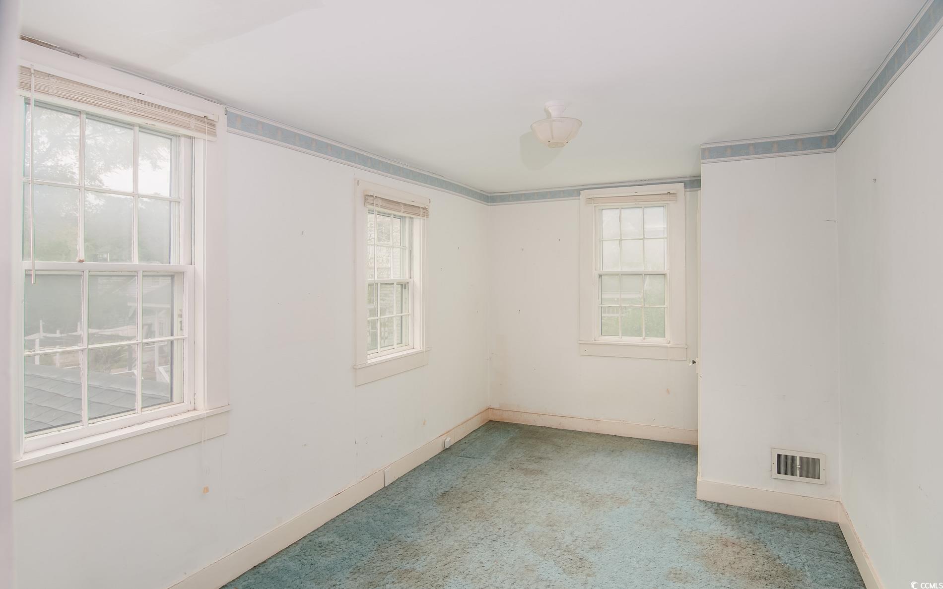 1010 Highmarket Street Georgetown, SC 29440 - Photo 21 of 32 Spare room featuring carpet and baseboards