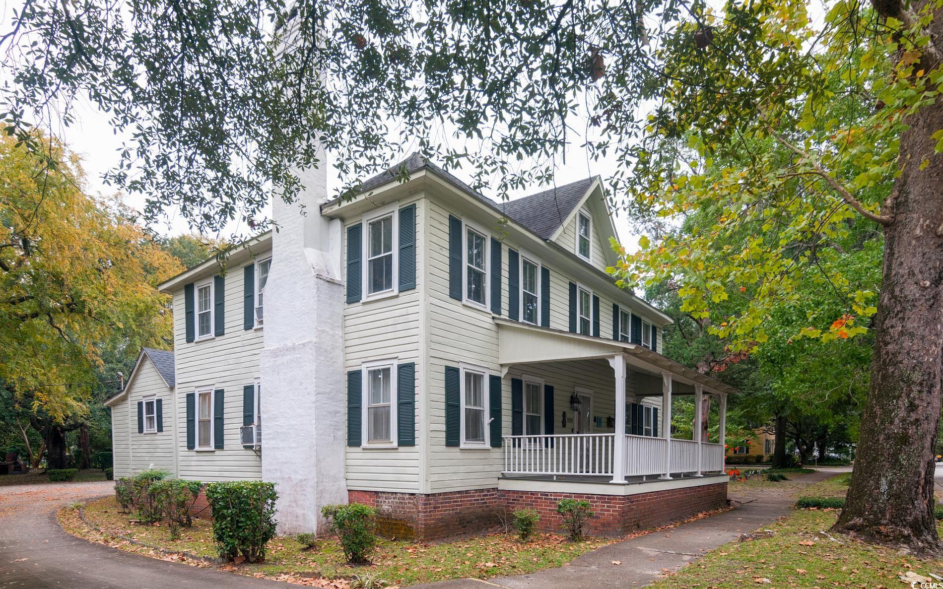1010 Highmarket Street Georgetown, SC 29440 - Photo 3 of 32 View of home's exterior featuring a porch and a chimney