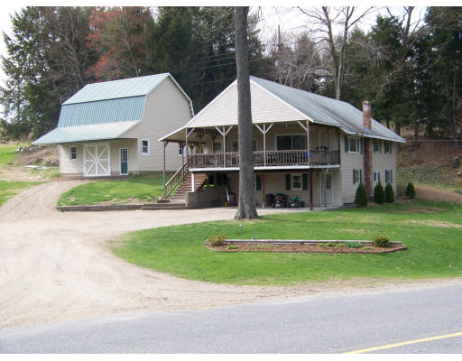 13 West Gill Road Gill, MA 01354 - Photo 1 of 1 a view of a big house with a big yard plants and large trees