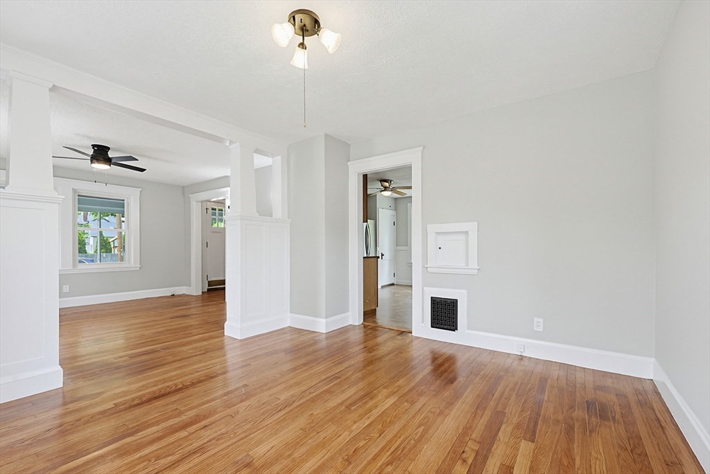 10 Water Street Natick, MA 01760 - Photo 7 of 35 a view of a livingroom with wooden floor fireplace and window