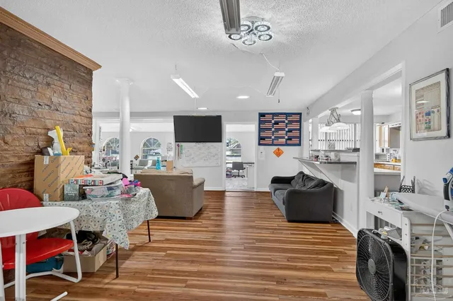 a bedroom with two beds and painting on the wall