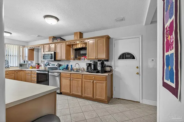 a bedroom that has a bed and a table in it