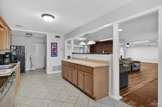 a view of a hallway with a wooden floor