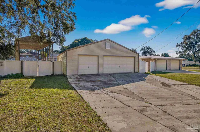 a living room with lots of furniture a chandelier a fireplace and a large window
