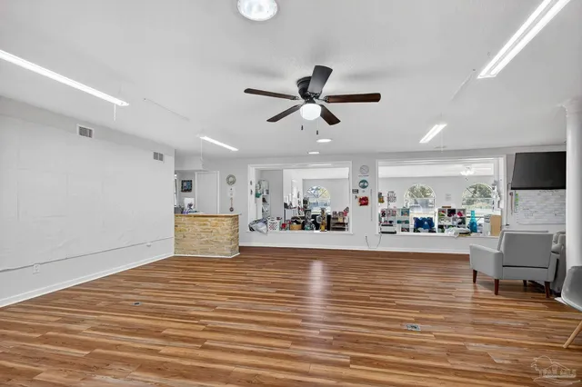 a kitchen with stainless steel appliances granite countertop a refrigerator sink and cabinets