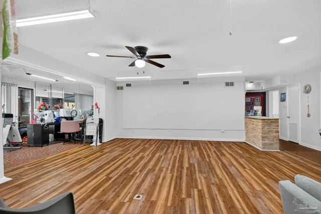 a kitchen with stainless steel appliances a sink stove and cabinets