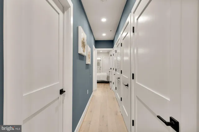 a bathroom with a sink and glass door